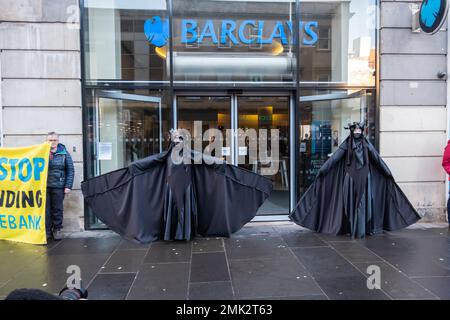 Glasgow, Scotland, UK. 28th January, 2023. Members of The Oil Slicks, environmental campaigners from the group Extinction Rebellion protesting in Argyle Street outside the premises of Barclays Bank. Credit: Skully/Alamy Live News Stock Photo