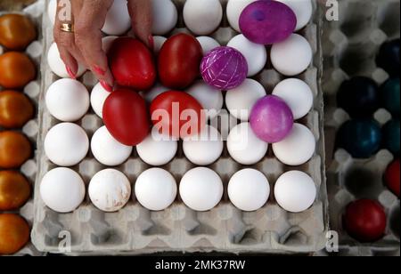 A buyer chooses hand decorated Easter eggs at a market in Belgrade, Serbia, Friday, April 26, 2019. Orthodox Serbs celebrate Easter on April 28, according to old Julian calendar. (AP Photo/Darko Vojinovic)