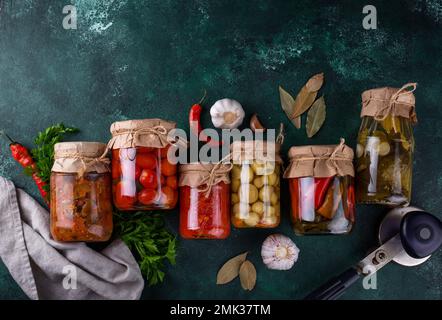 Pickled vegetables in glass jars. Stock Photo