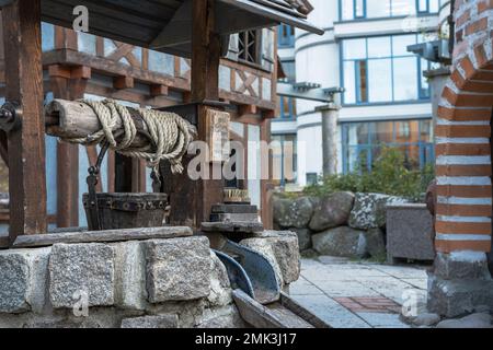 Water well that stands in the Swedish city of Uppsala, illustrates the old times in Sweden Stock Photo