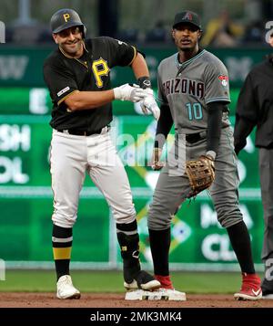 Pittsburgh Pirates Francisco Cervelli (29) and home plate umpire DJ  Reyburn, left, react after both being hit by a pitch as Toronto Blue Jays  catcher Dioner Navarro, centre, looks to help during