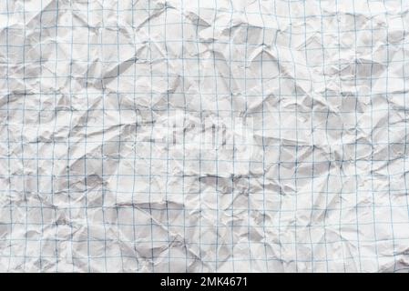 Texture of crumpled white paper in a cage, school notebook. White background Stock Photo