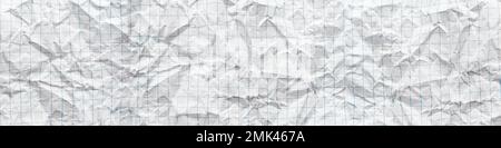 Texture of crumpled white paper in a cage, school notebook. White background. Paper web banner Stock Photo