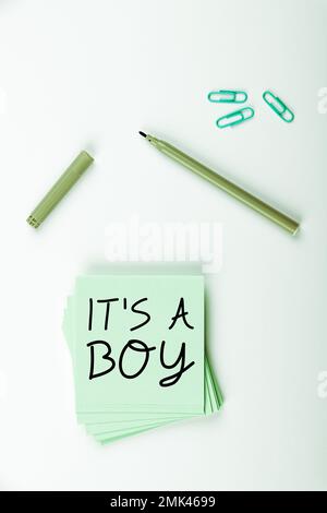 Writing displaying text It's A Boy. Business idea Expecting a male baby cute blue colors a lot of car toys Stock Photo