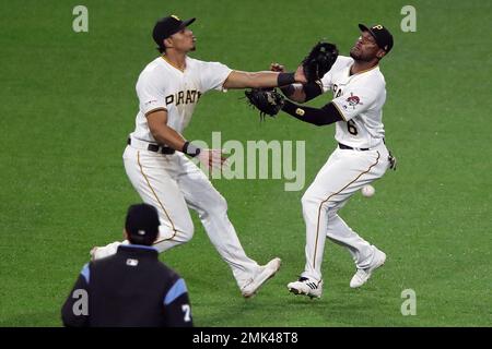 Milwaukee, USA. August 24, 2018: Pittsburgh Pirates center fielder Starling  Marte #6 along with the Brewer infielders watch the review challenge on the  jumbo screen of Martes stolen base in the 11th