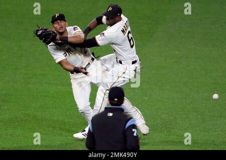 Milwaukee, USA. August 24, 2018: Pittsburgh Pirates center fielder Starling  Marte #6 along with the Brewer infielders watch the review challenge on the  jumbo screen of Martes stolen base in the 11th