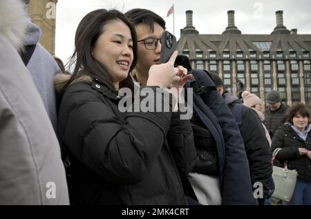 London, England, UK. Young Asian couple posing for a selfie on Westminster Bridge. Stock Photo