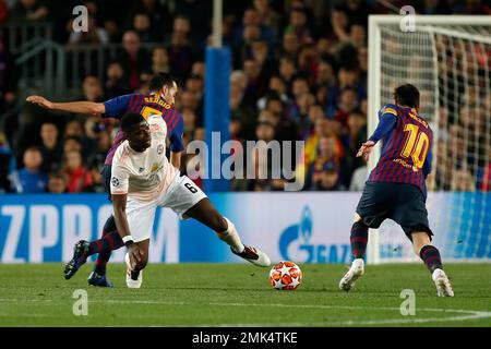 Barcelona midfielder Sergio Busquets heads the ball over AC Milan  midfielder Kevin Prince Boateng, of Ghana, during a Champions League first  leg quarterfinals soccer match, between AC Milan and Barcelona, at the