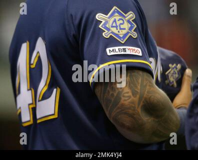 Milwaukee Brewers' Eric Thames stands in the dugout in the fourth inning of  a baseball game against the Cincinnati Reds, Sunday, July 1, 2018, in  Cincinnati. (AP Photo/John Minchillo Stock Photo - Alamy