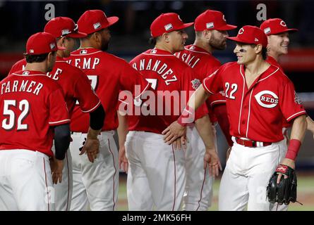 Cincinnati Reds' Derek Dietrich, right, celebrates with Kyle