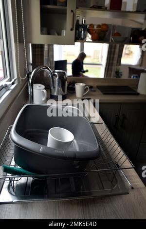 washing up bowl in static caravan kitchen sink Stock Photo