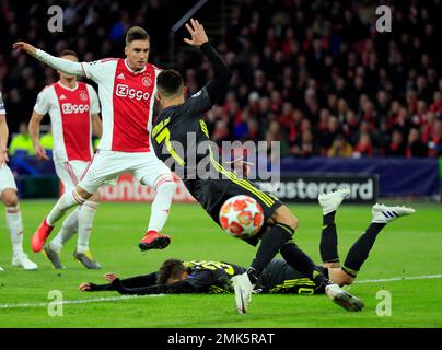 Juventus forward Cristiano Ronaldo center celebrates with teammates after scoring his side s opening goal during the Champions League quarterfinal first leg soccer match between Ajax and Juventus at t...