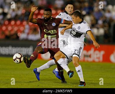 Santiago Damian Garcia Correa of Argentina's Godoy Cruz heads to score  against Paraguay's Olimpia during a Copa Libertadores soccer game in  Asuncion, Paraguay, Tuesday, April 9, 2019. (AP Photo/Jorge Saenz Stock  Photo 