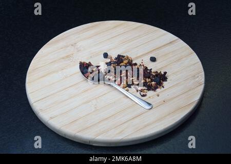 tea on a spoon on a wooden board Stock Photo