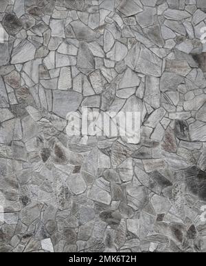 Front view of stone wall made of weathered stone slates. Abstract high resolution full frame textured background in black and white. Stock Photo