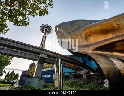 Monorail track and Space Needle, Corrugated coloured exterior facade of the Museum of Pop Culture, detail, MoPOP, architect Frank Gehry, Seattle Stock Photo