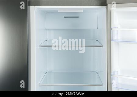 Shelves of empty modern refrigerator, closeup view Stock Photo