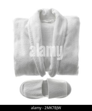 Clean folded bathrobe and slippers isolated on white, top view Stock Photo