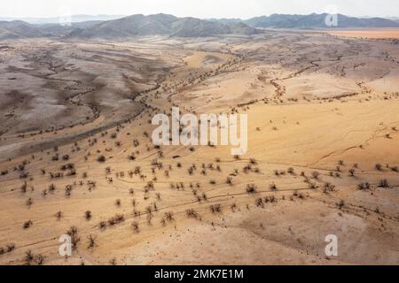 Badlands and dry river beds after years of drought, aerial view, drone shot, Kaokoland, Kunene Region, Namibia Stock Photo