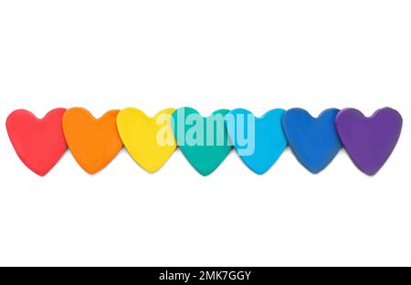 Colorful hearts made of modeling clay on white background, top view. Rainbow palette Stock Photo