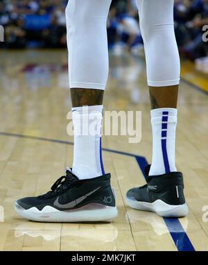 A detailed view of the Nike KD basketball shoes worn by Kevin