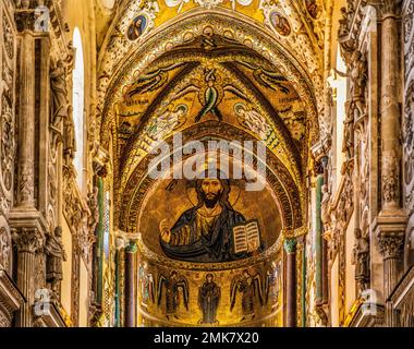Mosaic Christ Pantocrator, Norman Cathedral Santissimo Salvatore, Cefalu with picturesque old town, Cefalu, Sicily, Italy Stock Photo