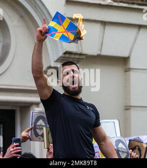 London, England, UK. 28th Jan, 2023. Muslim protesters burn Swedish flag outside London embassy of Sweden after danish origin right wing man burns Quran outside Turkish embassy in Sweden. (Credit Image: © Tayfun Salci/ZUMA Press Wire) EDITORIAL USAGE ONLY! Not for Commercial USAGE! Stock Photo