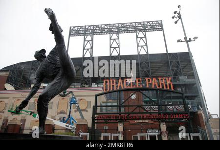 The statue of former pitcher Juan Marichal is shown in front of sign for  Oracle Park before an exhibition baseball game between the San Francisco  Giants and the Oakland Athletics in San Francisco, Monday, March 25, 2019.  (AP Photo/Jeff Chiu Stock Phot