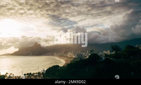 Aerial drone view of dramatic clouds over Ipanema Beach in Rio de Janeiro, Brazil at sunset Stock Photo