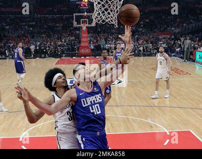 Brooklyn Nets' Jarrett Allen, left, celebrates a basket with teammate Joe  Harris during the first half of an NBA basketball game against the San  Antonio Spurs, Thursday, Dec. 19, 2019, in San