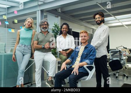 Portrait of confident multiracial professional business people team looking at camera happy face. Stock Photo