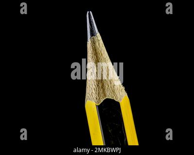 Close-up yellow and black pencil on black background. Stock Photo