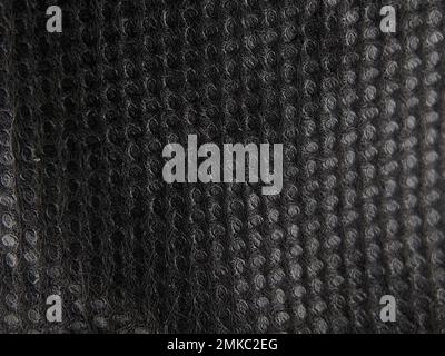 Close-up black bag blanket background and texture. Stock Photo