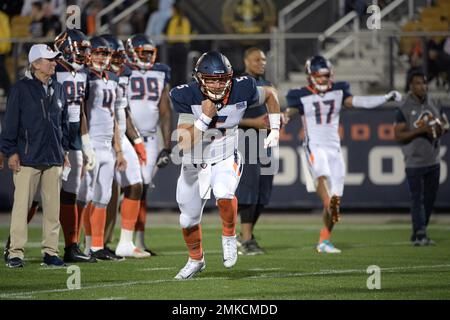 Orlando Apollos quarterback Austin Appleby (5) and offensive lineman Ronald  Patrick (71) warm up before an