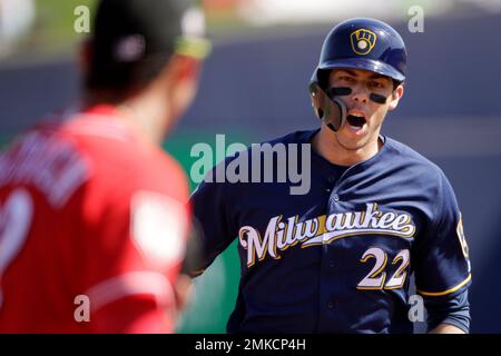 Cincinnati Reds' Derek Dietrich rounds second base after hitting a