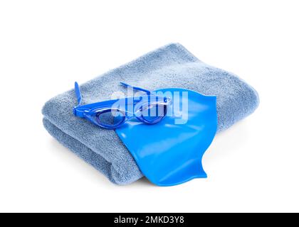 Swimming cap, goggles and towel isolated on white Stock Photo