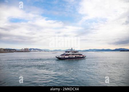 Hiroshima Japan 3rd Dec 2022: the ferry is on the way from Miyajima guchi to Island Itsukushima, this small island has since ancient times Stock Photo
