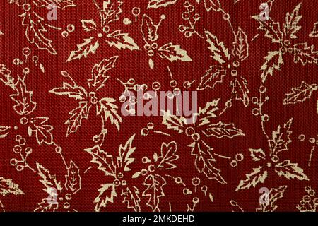 Red Fabric with White Holly Leaves and Berries (Festive Pattern) Stock Photo