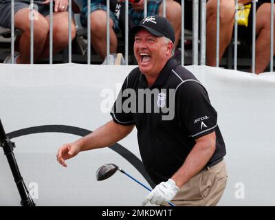 Former professional baseball player AJ Pierzynski watches his tee shot on  the 11th hole during the