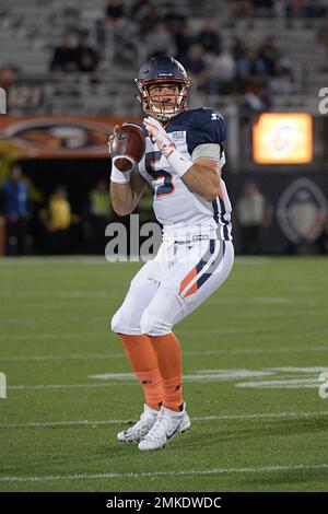 Orlando Apollos quarterback Austin Appleby (5) and offensive lineman Ronald  Patrick (71) warm up before an