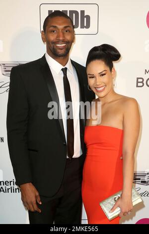 Metta World Peace, left, and Kimsha Artest arrive at the 2019 Elton
