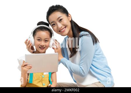 A young female teacher counseling students learning Stock Photo