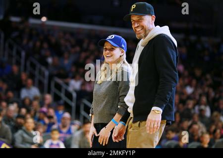 Reese Witherspoon and her husband Jim Toth attend The Harlem Globetrotters game at Staples Center on Feb. 17, 2019, in Los Angeles. (Photo by John Salangsang/Invision for The Harlem Globetrotters/AP)