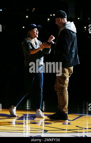 Reese Witherspoon and her husband Jim Toth attend The Harlem Globetrotters game at Staples Center on Feb. 17, 2019, in Los Angeles. (Photo by John Salangsang/Invision for The Harlem Globetrotters/AP)