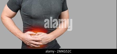 liver pain. highlighted painful liver of man on grey background. man having liver ache, painful area highlighted in red. liver disease, diagnosis and Stock Photo