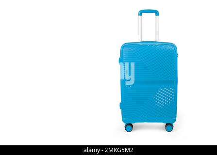 Suitcase isolated on white. Blue, fashionable travel suitcase on white background with shadow. Blue travel luggage Stock Photo
