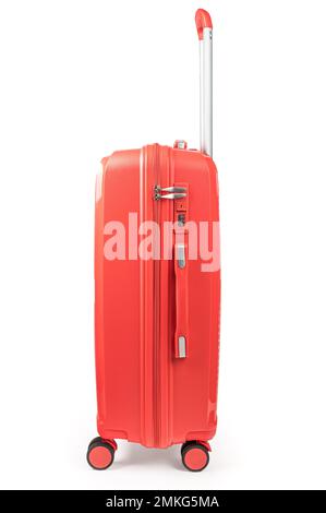 Suitcase isolated on white. Red, fashionable travel suitcase on white background with shadow. Red travel luggage Stock Photo