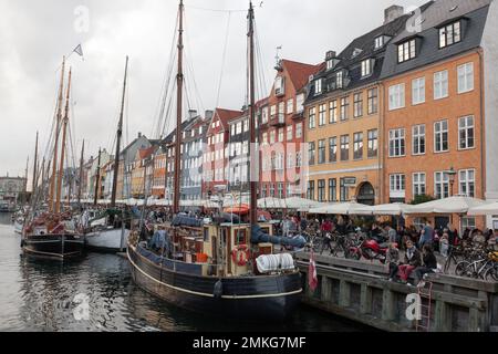 COPENHAGEN, DENMARK -JULY 17, 2016: beautiful harbor with many boats in the canal between the houses Stock Photo