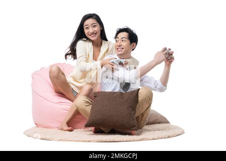 Young couple together playing computer games Stock Photo