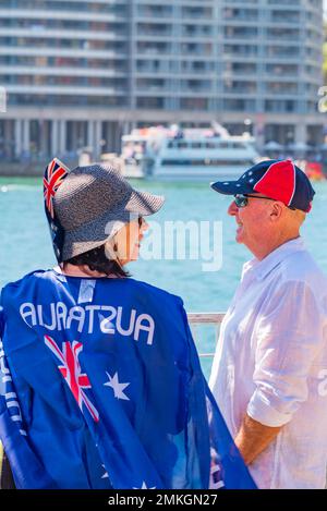 People wearing Red White and Blue of the Australian Flag during celebrations at Circular Quay on Australia Day January 26th, 2023 Stock Photo